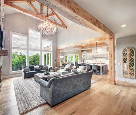 hearth room  wooden beams  chandelier large windows  open concept luxury house