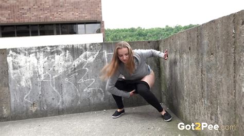 blonde teen suzzie baring her pussy lips and sexy ass and pissing in public