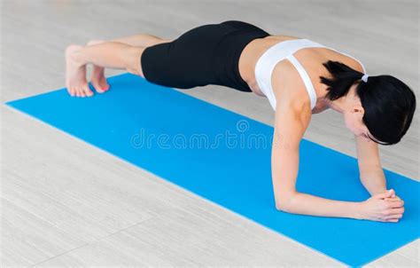 Slim Fitnes Young Girl Doing Planking Exercise Indoors At Home