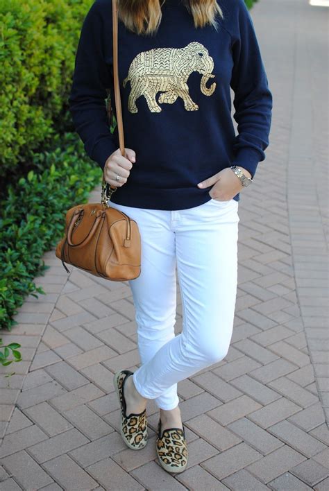 casual outfit white jeans gold elephant sweatshirt leopard sneakers elephant sweatshirt