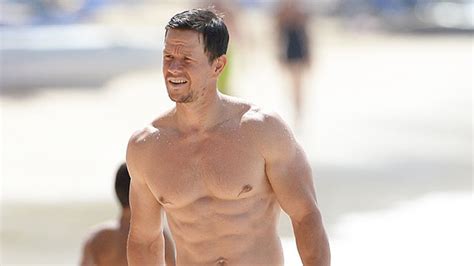 Mark Wahlberg Bares Back And Arms While Showing Off