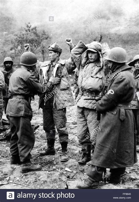 korean war 1950 nturkish soldiers search chinese prisoners after an engagement december 1950