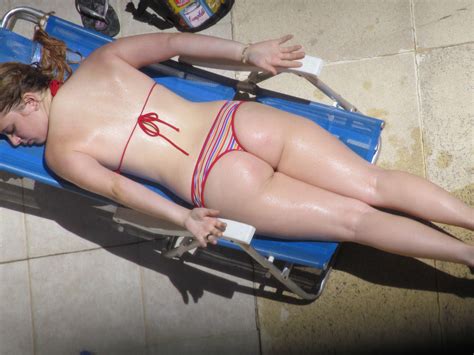 voyeuy voyeur neighbour sunbathing in red and stripped bikini