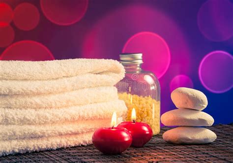 Spa Massage Border Background With Towel Stacked Red Candles And Stone