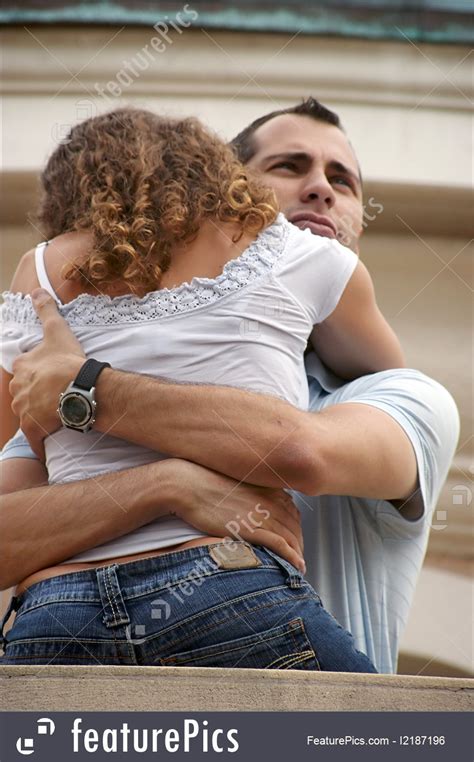 People Handsome Proud Man Hugging Woman Close On Balcony
