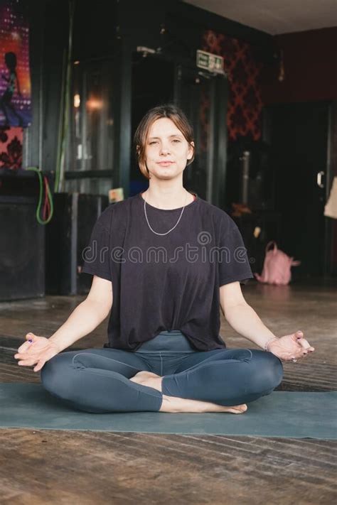 female  yoga teacher resting  easy pose sukhasana