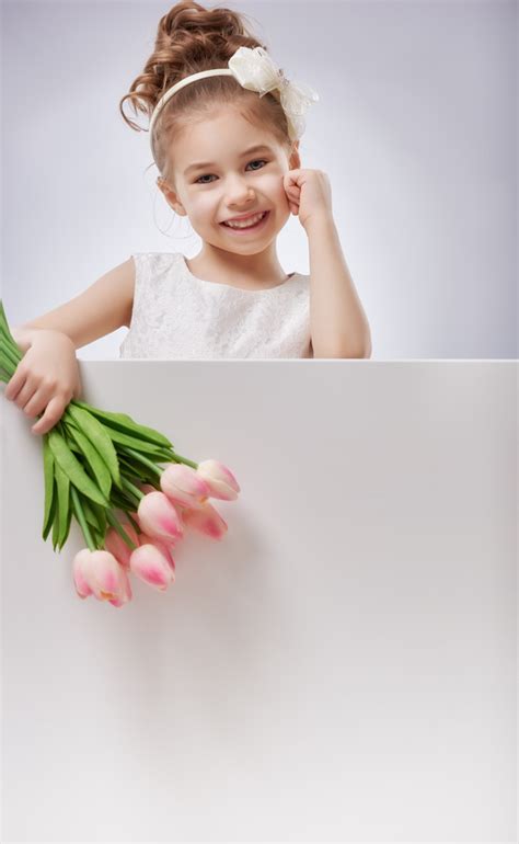 girl holding flowers stock photo
