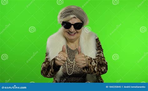 Old Style Granny Caucasian Woman Puts On Sunglasses Chroma Key