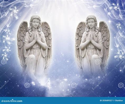 Two Praying Angels With GodÂ´s Rays Of Light With Blue Mystic