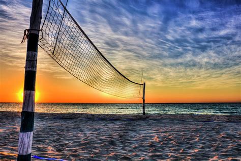 beach volleyball net at sunset photograph by paul thompson pixels