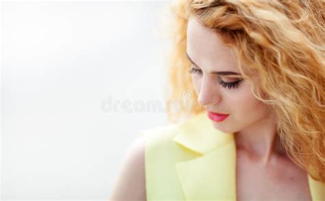 Close Up Portrait Of Seductive Redhead Girl With Red Lips In A Yellow