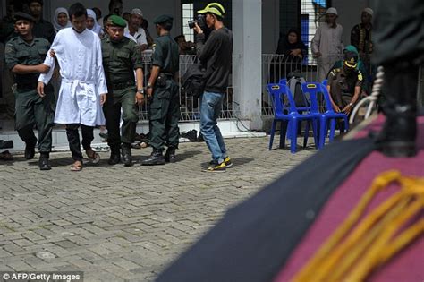 man and woman are caned 100 times each in brutal punishment for adultery in indonesia daily