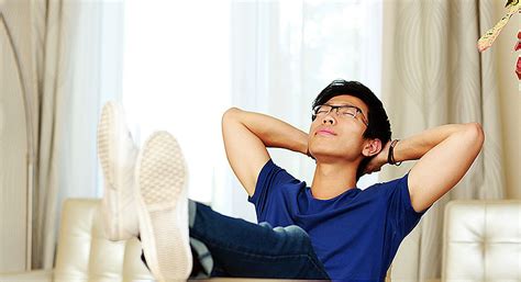 asian man relaxing  home editorial stage
