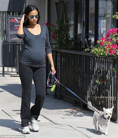 zoe saldana dresses her bump in casual fitted top daily mail online