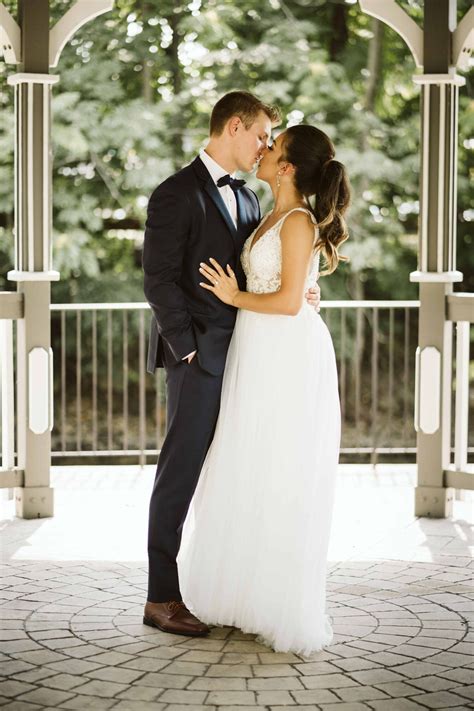 bride  groom kissing   archway