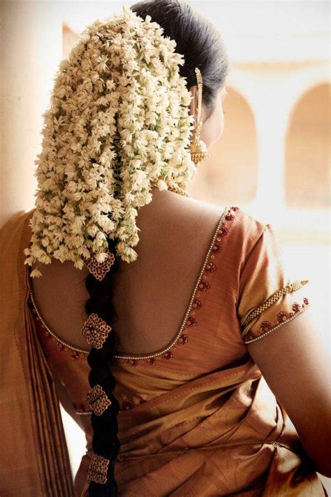 south indian bride wearing traditional gajra hairstyle  bosco naveen