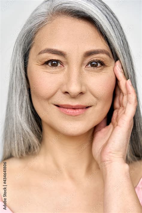 closeup portrait of gorgeous happy middle aged mature asian woman