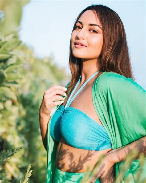 sonakshi sinha flaunts washboard abs   blue bikini top  green