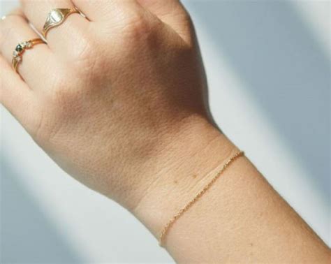 woman  bracelet permanently welded   wrist  latest beauty trend grill