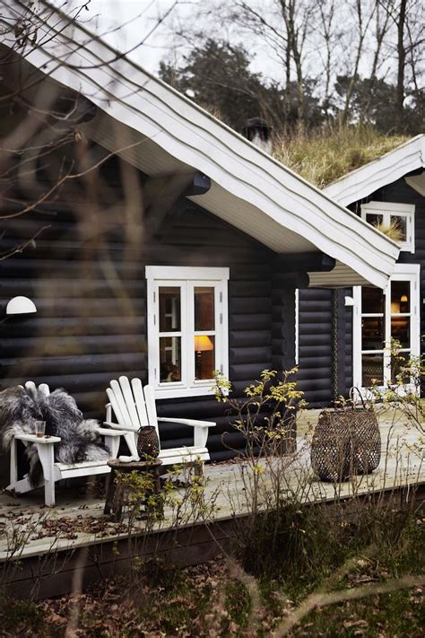 log cabin   white adiron chairs   front porch   open door