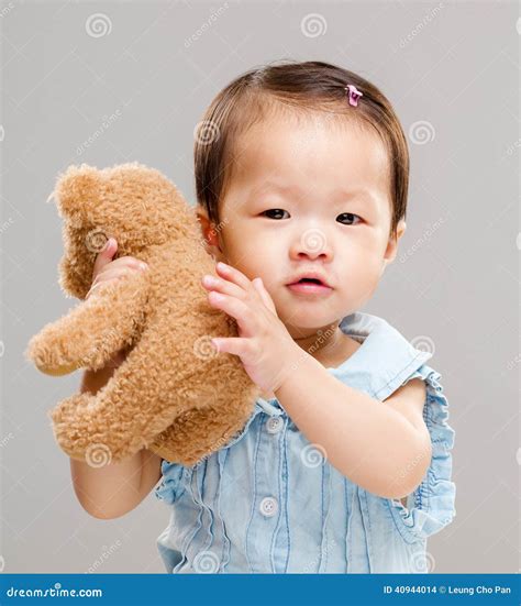 sweet baby girl hug  toy doll stock photo image  love japanese