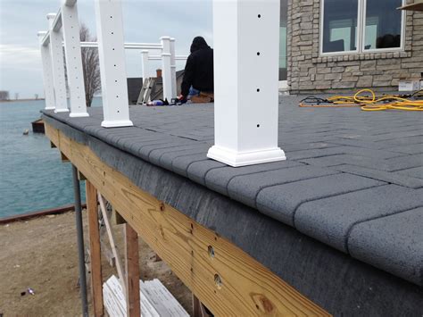 outdoor living  sloped roof decks composite pavers  cable rail