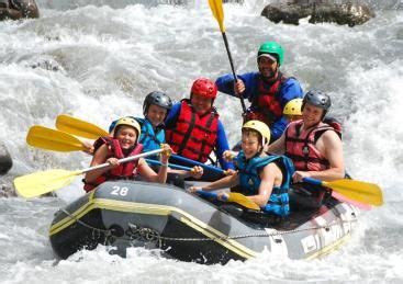 group  people riding      raft   river