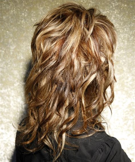 Long Wavy Caramel Brunette Hairstyle With Side Swept Bangs And Light