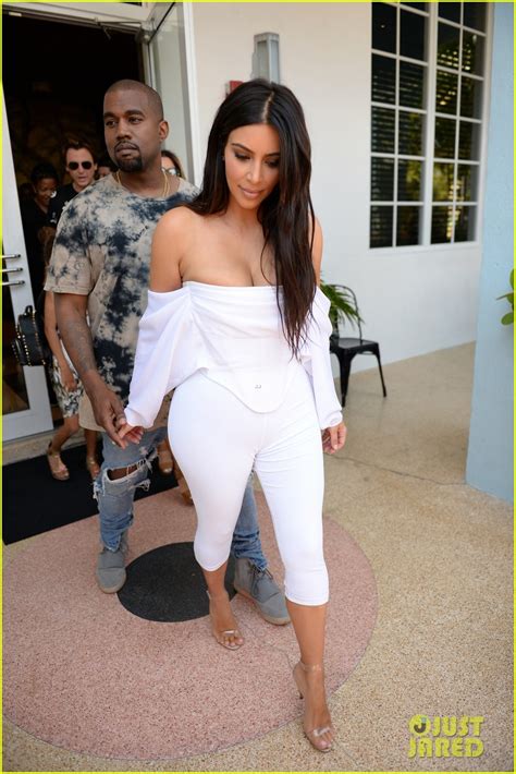 kim kardashian flaunts curves and cleavage in white jumpsuit photo