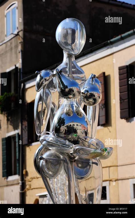 A Glass Sculpture Of A Human Figure From Murano Glass In