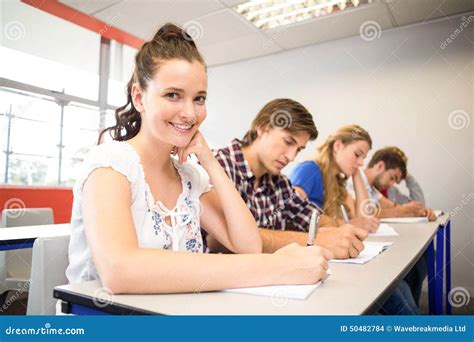 students writing notes  classroom stock photo image  learn adult