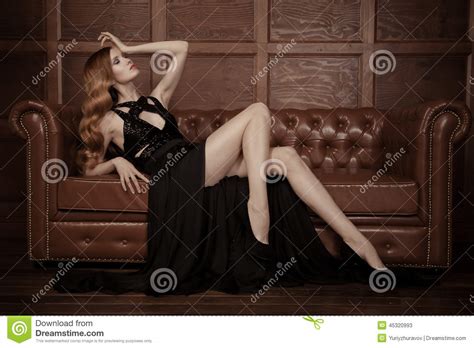 Beautiful Luxurious Woman Sitting On A Leather Vi Stock
