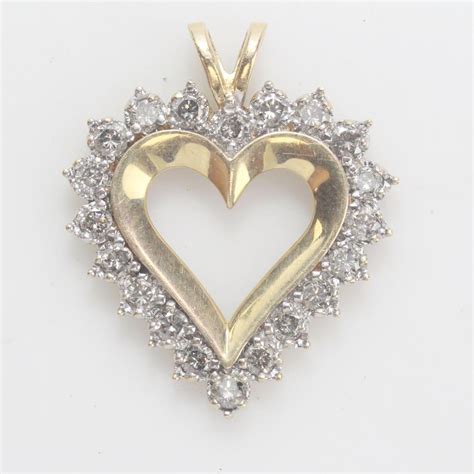 kt gold  heart shaped pendant  diamond accents property room