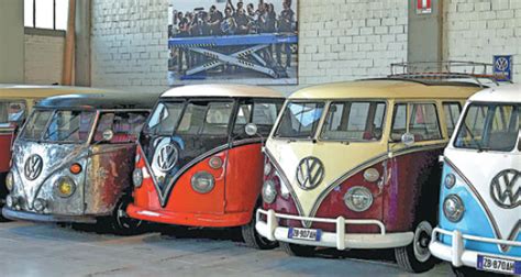 restored volkswagen campers at the garage in florence