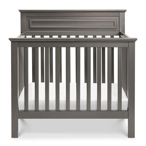gray crib  white sheets   top  bottom rails  front