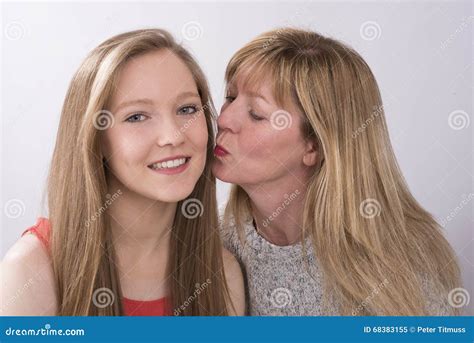 Mature Woman Kissing A Teenage Girl Stock Image Image Of Women