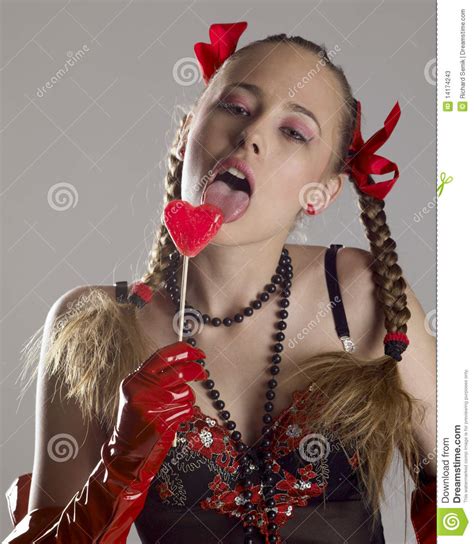 young adult woman  pigtails  lollipop royalty  stock image