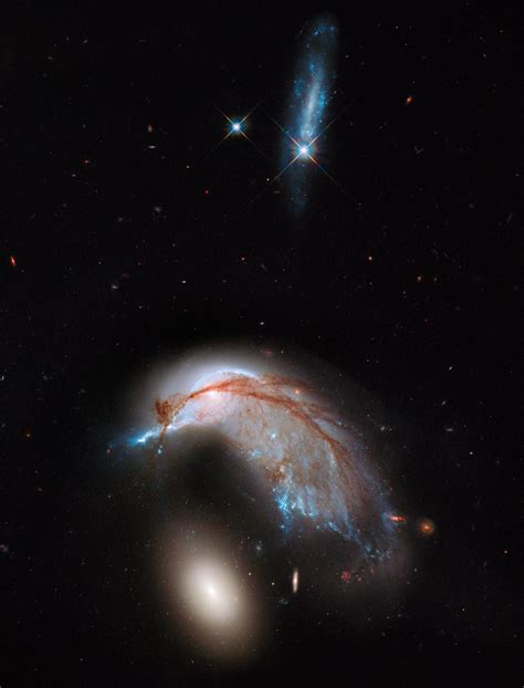 hubble views interacting galaxy duo arp