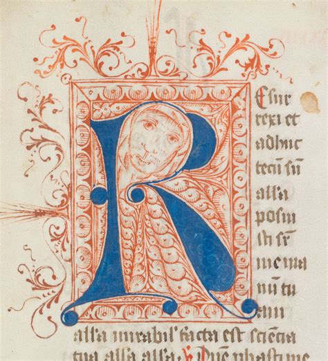 illuminated letter decorated  interlace  filled   human face manuscripts