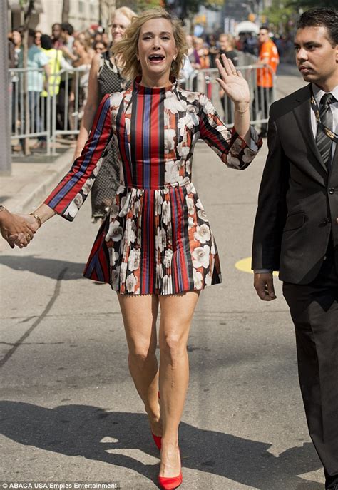 Kristen Wiig Parades Her Perfect Legs In Floral And Stripe Patterned