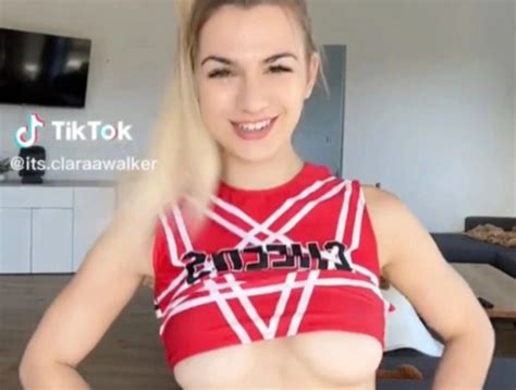 cheerleader clara walker shows off underboob in her uniform and goes