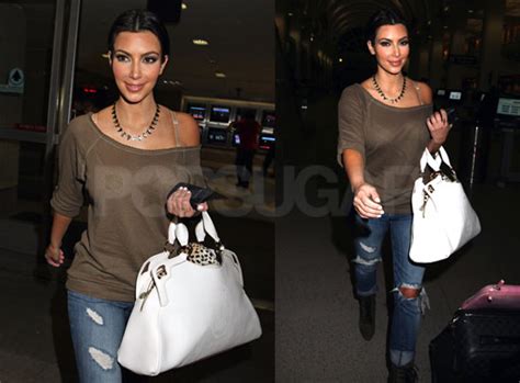 photos of kim kardashian arriving at lax airport wearing cute jeans