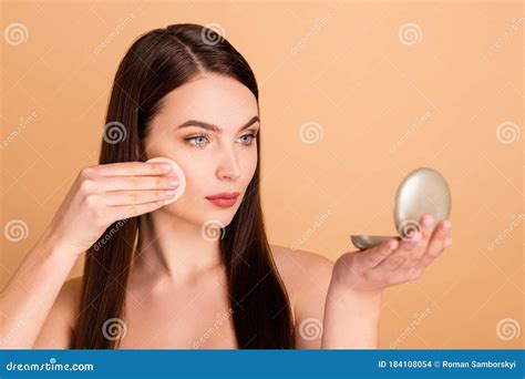 close up photo of dreamy magnificent girl use cotton pad look mirror