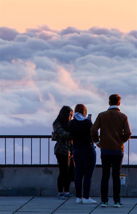 people standing  clouds  nature stock photo