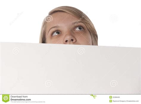 teenage girl holding blank sign looking upward stock