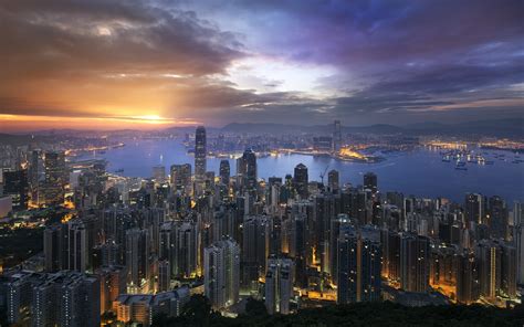 landscape cityscape skyscraper building sunrise lights bay pier hong kong sea mountain