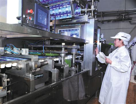 a technician working on a production line in a food