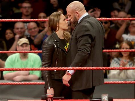 wwe elimination chamber results ronda rousey throws triple h through a table after signing full