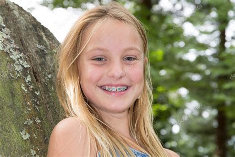 Portrait Of Smiling Teen Girl Showing Dental Braces