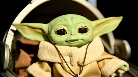 disney finally unveils baby yoda toys months   tv debut
